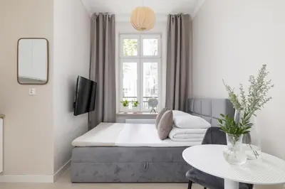 a living room with a bed and a window at Studio for two - Kazimierz District - Starowiślna 43 in Kraków