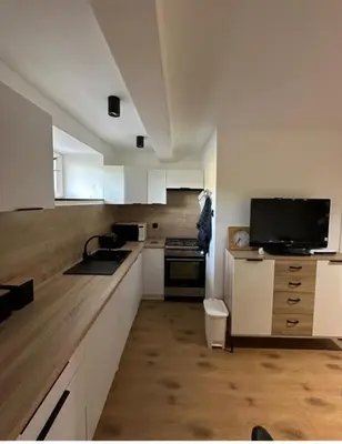 a living room with a couch and a table at Apartament u Majki in Bystra
