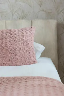 a bed with a pink pillow and a pink blanket at Pink & Blue Cozy Studio in Kraków by Noclegi Renters in Kraków