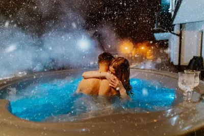 a man and woman sitting in a hot tub at Willa Bania Rabka Zdrój - Bezpłatny całodzienny basen - blisko centrum - Widok na Babią Górę in Rabka