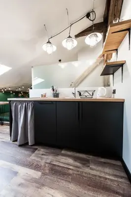 a kitchen with a sink and a counter top at Studio with an AC - Dietla 51 street in Kraków