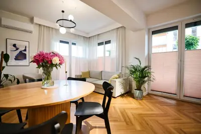 a living room with a table and a couch at Apartament Indigo 11 by Housine in Zator