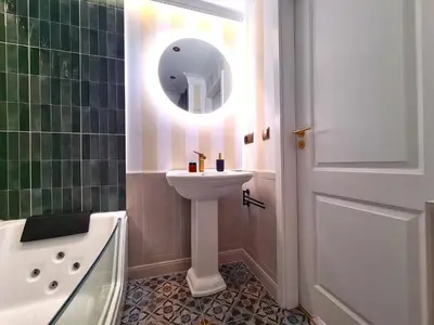 a bathroom with a sink and a mirror at WANNA SPA na Starym Mieście in Kraków