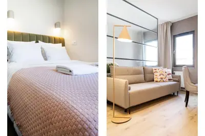 a bedroom and a living room with a bed and a couch at Househost Apartment Smoleńsk 33-309A in Kraków