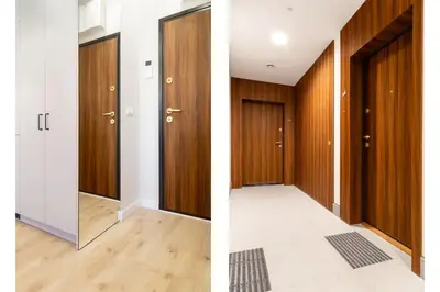 an empty corridor with wooden doors and a hallway with a floor at Househost Apartment Smoleńsk 33-309A in Kraków