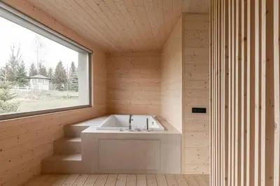 a small bathroom with a sink and a window at Poczywaj in Jordanów