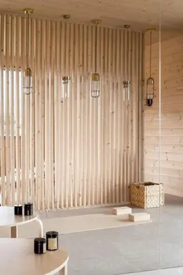 a room with two tables and a glass wall at Poczywaj in Jordanów