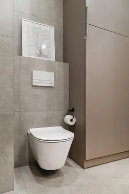 a bathroom with a toilet and a picture on the wall at Househost Apt Smoleńsk 33-308A in Kraków