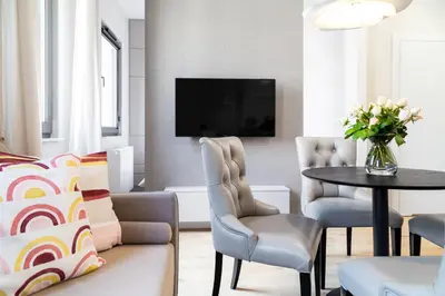a living room with a couch and a table at Househost Apt Smoleńsk 33-308A in Kraków