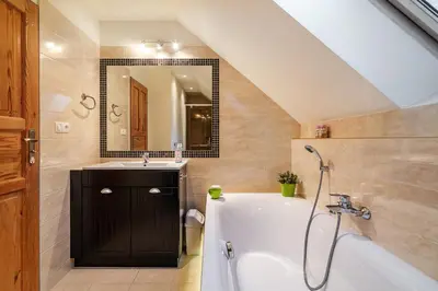 a bathroom with a shower and a toilet at Villa Teresa in Trzebinia