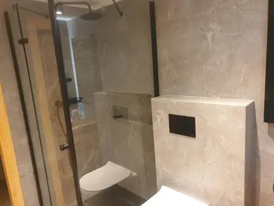 a shower stall with a toilet in a bathroom at Dom pod Wieliczką in Wieliczka