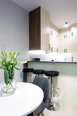 a bathroom with a sink and a shower and a mirror at Native Apartments Słowackiego 14/6 Deluxe in Kraków
