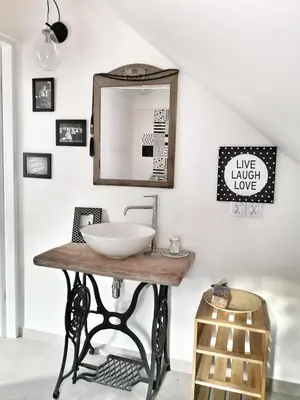 a bathroom with a sink and a mirror at Bluszcz i Lawenda in Jankowice