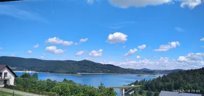 a view of a lake from a house at DOMEK W HORTENSJACH in Mucharz