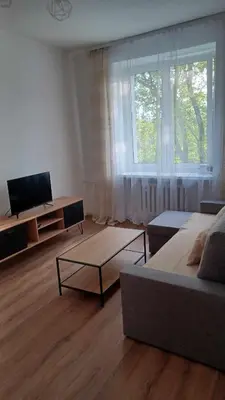 a living room with a couch and a tv at Good Apartament Skawina in Skawina