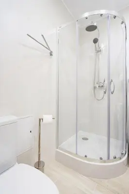 a shower with a glass door in a bathroom at Apartment for two-Jewish Quarter-Starowiślna 54 in Kraków