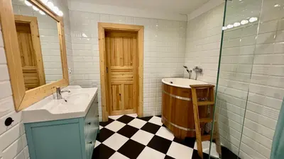 a bathroom with a sink and a shower at Dom w Starym Sadzie z basenem i sauną - Beskid Wyspowy in Nowe Rybie