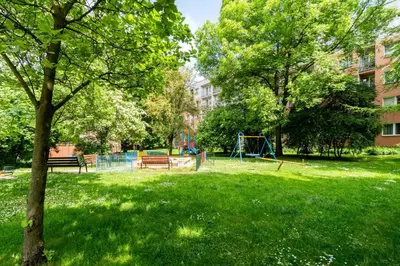 a park with a playground in the grass at Olsza Comfy Apartment by BookingHost in Kraków