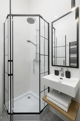 a bathroom with a sink and a shower at Balcony Apartment - Kazimierz- Starowiślna 41 in Kraków