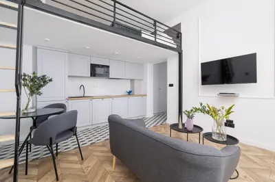 a living room with a couch and a table at Balcony Apartment - Kazimierz- Starowiślna 41 in Kraków
