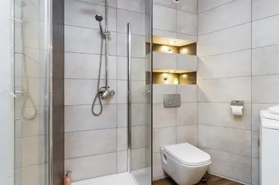 a bathroom with a shower and a toilet at Studio for two - Starowiślna 54 in Kraków
