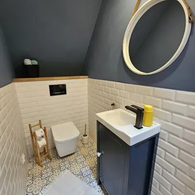 a bathroom with a sink and a mirror and a toilet at Casa Viento in Stryszawa