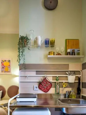a kitchen with a sink and a counter top at Crocus narrow studio / Kochanowskiego in Kraków
