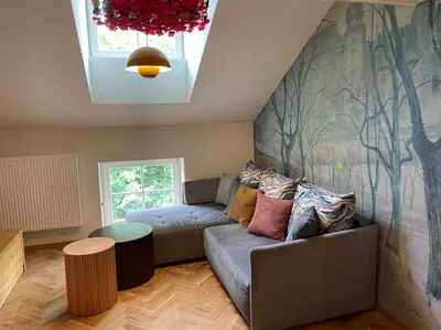 a living room with a couch and a table at Househost Apt: Gertrudy 10/43 in Kraków