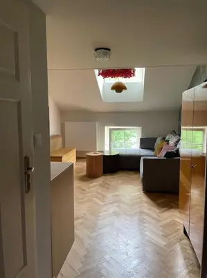 a living room with a couch and a table at Househost Apt: Gertrudy 10/43 in Kraków