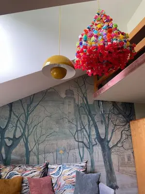 a room with a mural of trees on the wall at Househost Apt: Gertrudy 10/43 in Kraków