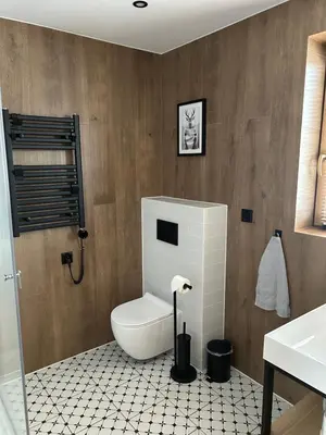a bathroom with a toilet and a sink at Wilczna Stodoła in Zawoja