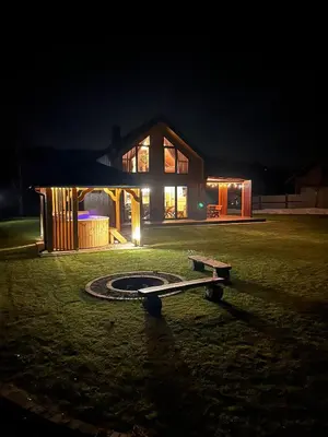 a house with a skateboard in front of it at night at Wilczna Stodoła in Zawoja