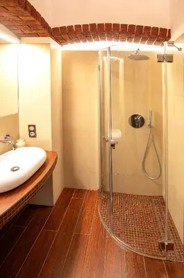 a bathroom with a shower and a sink at Apartamenty Winnicy Kresy III in Kraków
