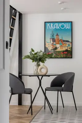 a dining room with a table and two chairs at Kazimierz - Apartment with Balcony - Starowiślna 41 in Kraków