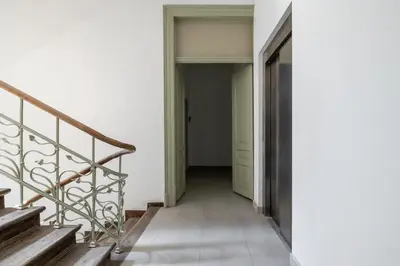 a hallway with stairs in a house at Kazimierz - Apartment with Balcony - Starowiślna 41 in Kraków