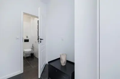 a bathroom with a black table and a toilet at Studio with an AC - Kazimierz - Starowislna 41 in Kraków