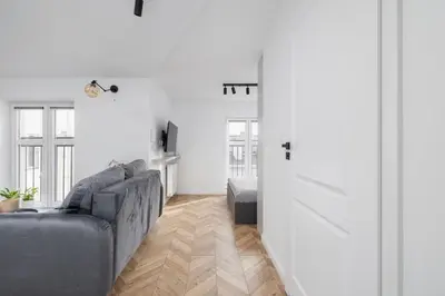 a living room with a couch and a table at Studio in Kazimierz District - AC - Starowislna 41 in Kraków