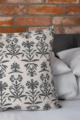 a pillow with a black and white pattern on it at Studio in Kazimierz District - AC - Starowislna 41 in Kraków