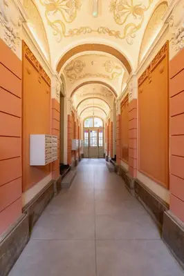 an empty hallway in a building with an ornate ceiling at Studio in Kazimierz District - AC - Starowislna 41 in Kraków