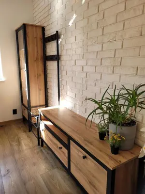 a room with a wooden table with plants on it at Apartamencik Pod Krokusem in Rabka-Zdroj