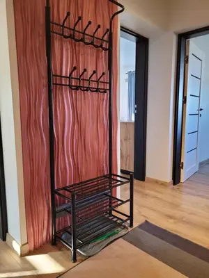 a room with a closet with a red curtain at Apartamencik Pod Krokusem in Rabka-Zdroj