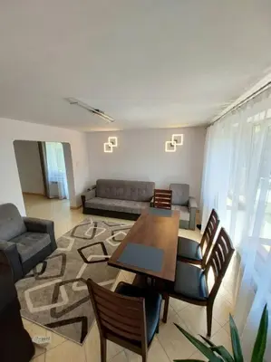 a living room with a table and a couch at House in Zabierzów in Zabierzów
