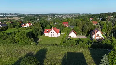 an aerial view of a village with houses and trees at House in Zabierzów in Zabierzów