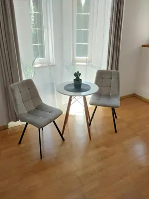 two chairs and a table in a room at House in Zabierzów in Zabierzów