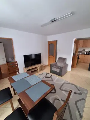 a living room with a dining table and a television at House in Zabierzów in Zabierzów