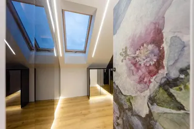 a painting on the wall of a room with windows at Luksusowy dom z basenem blisko Energylandii, Krakowa i Oświęcimia in Trzebinia