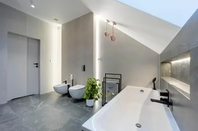 a bathroom with a large tub and two toilets at Luksusowy dom z basenem blisko Energylandii, Krakowa i Oświęcimia in Trzebinia