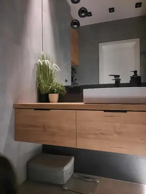 a bathroom with a sink and a mirror at Place4You in Kraków