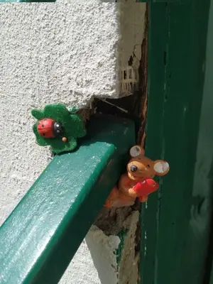 two toy animals sitting on the corner of a door at Dom pod Galazka in Bochnia