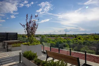 a patio with benches and a view of the city at Imperial Citi Yes Apartament in Kraków
